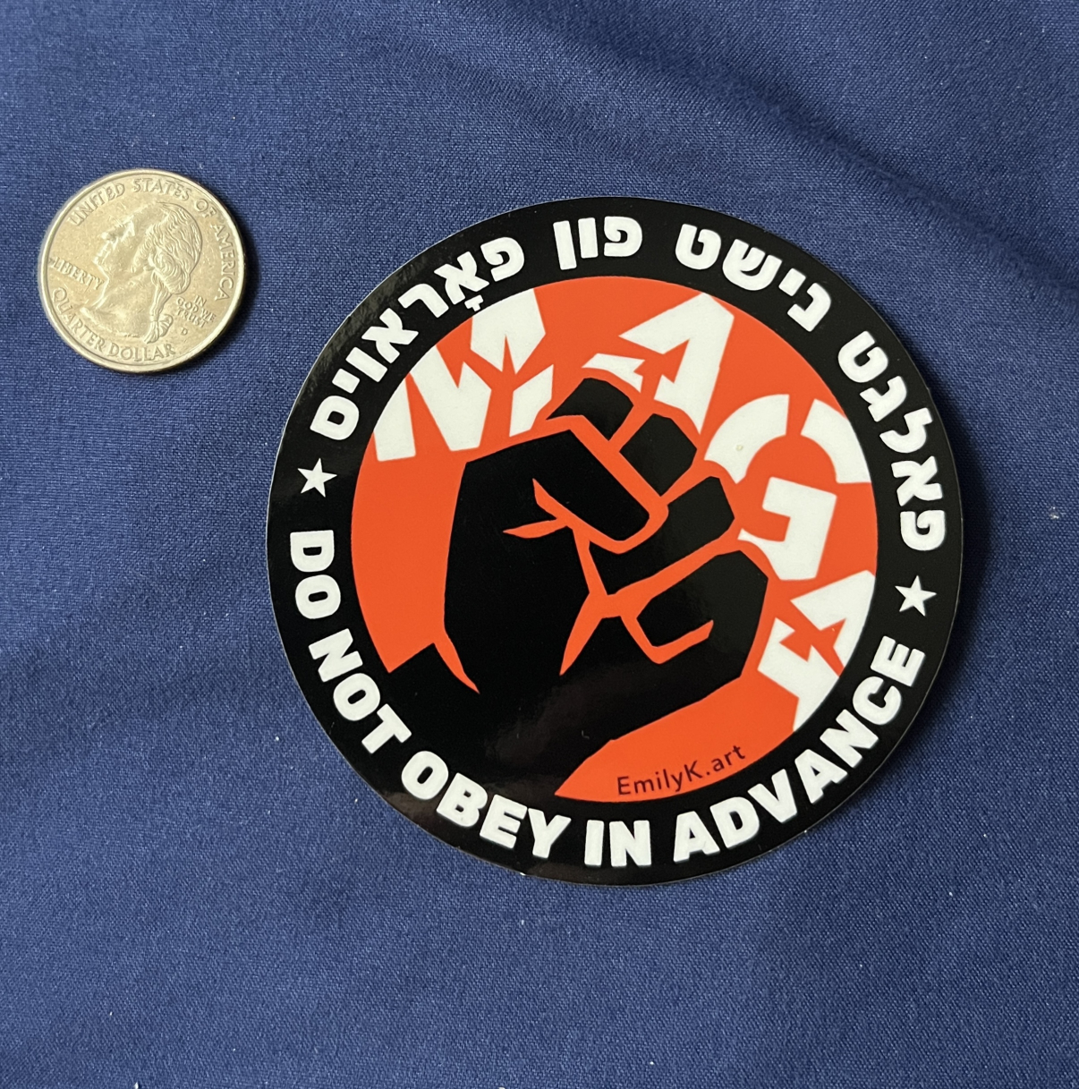 "Do not obey in advance" sticker with a quarter coin for scale.
