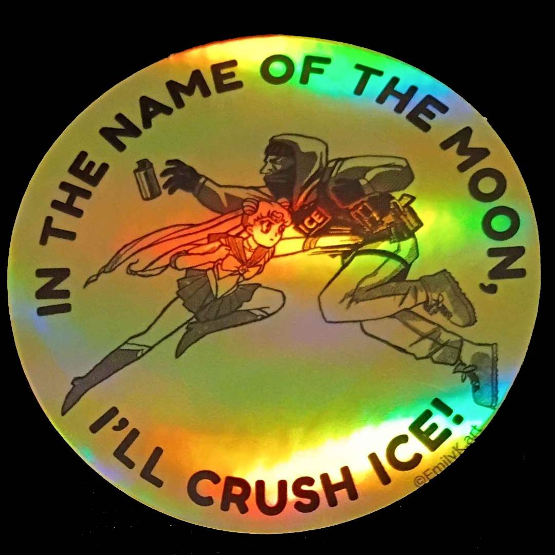 A yellow circular sticker with a holographic shiny sheen.